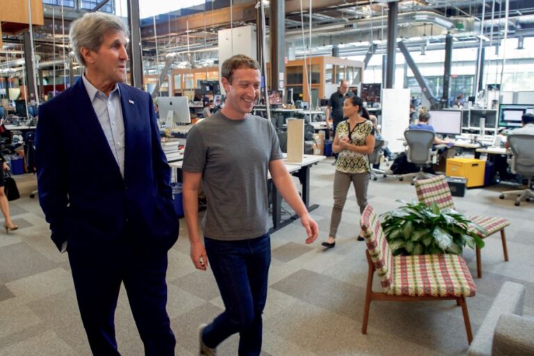 Greatest Tech Leaders Of All Time: Mark Zuckerberg walking with Senator Kerry